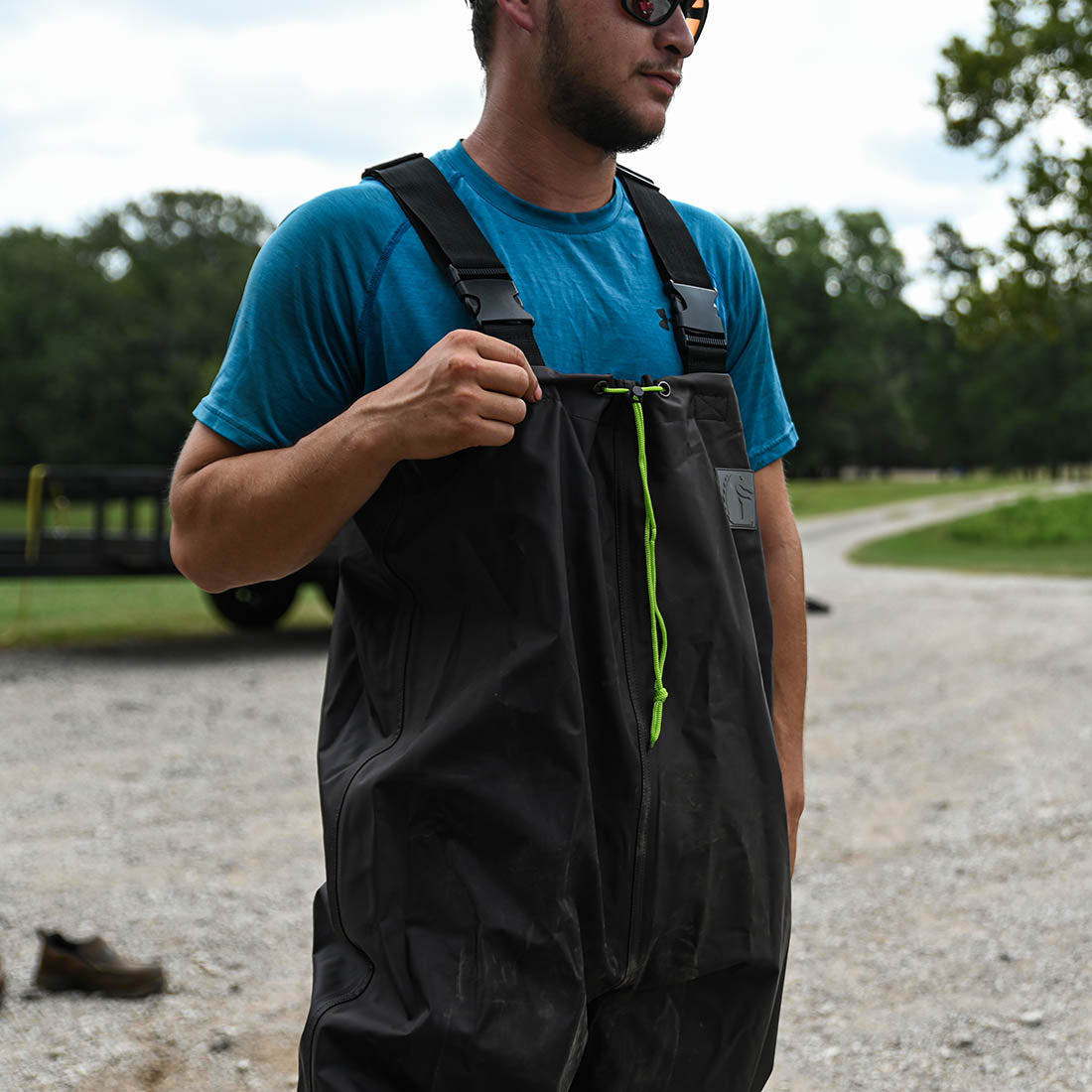 Man standing on road in Gator Waders Mudcat Offroad Waders